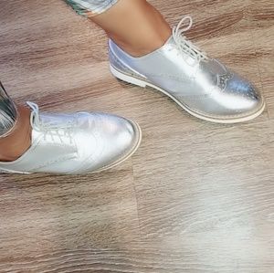 Silver shoes with embroidery detail